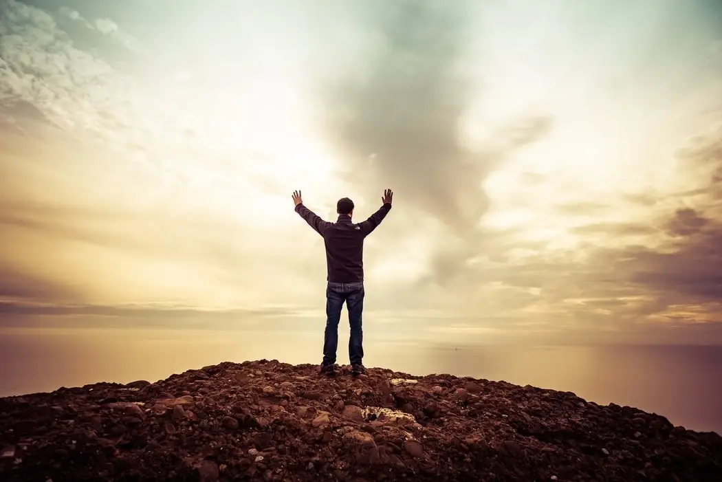 Man standing at the edge of a cliff