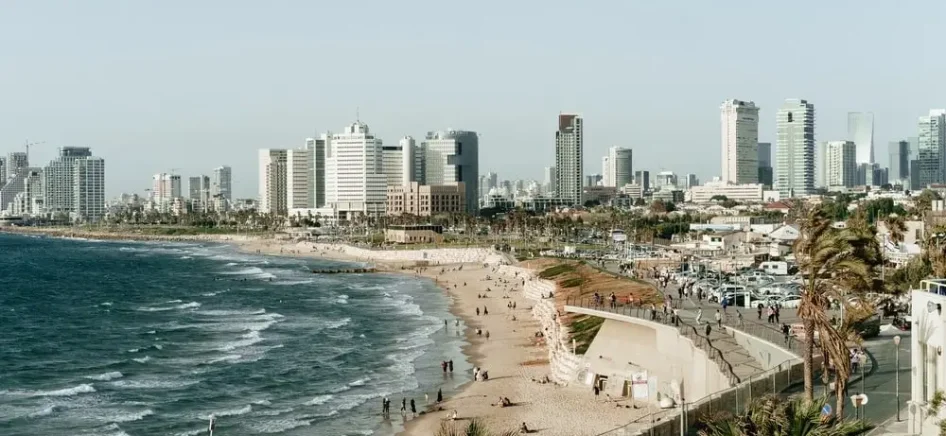 A beach in Tel Aviv with buildings visible in the background