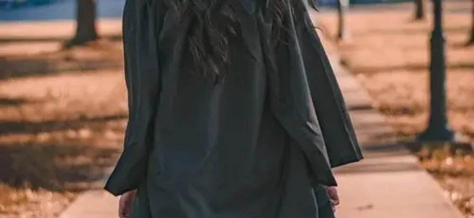 A university student in a graduation cap and gown