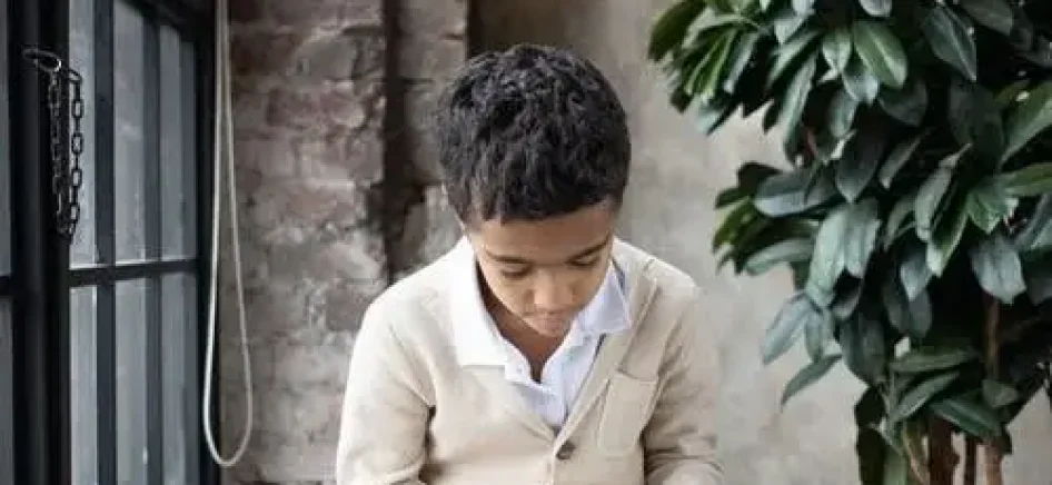 picture showing boy reading a book