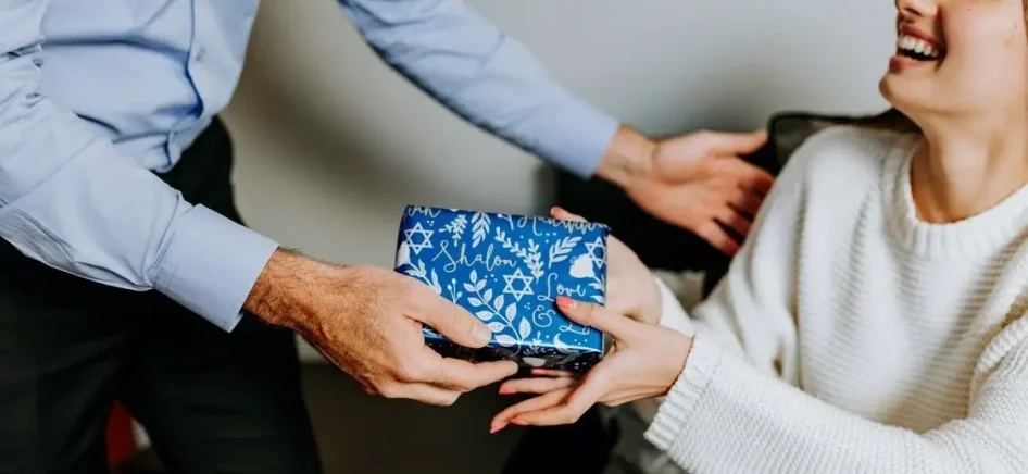 A man giving a gift to a woman