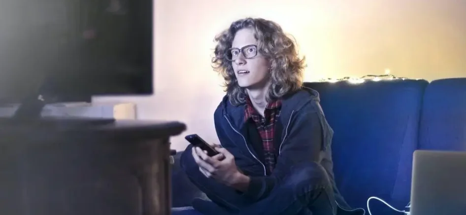 Person watching a movie on T.V