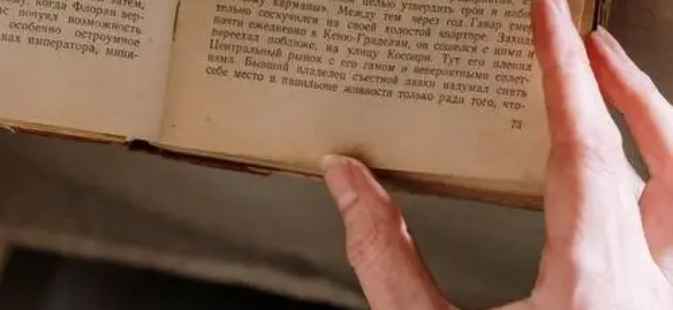 picture showing person reading Hebrew