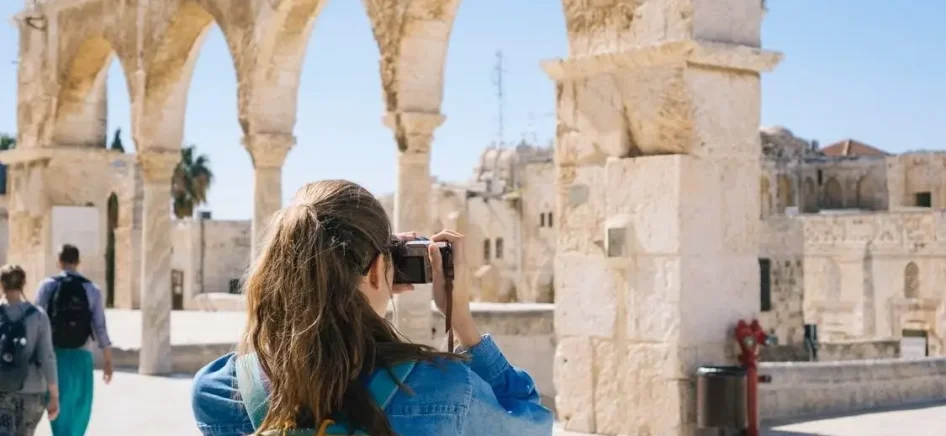 woman taking pictures in Israel